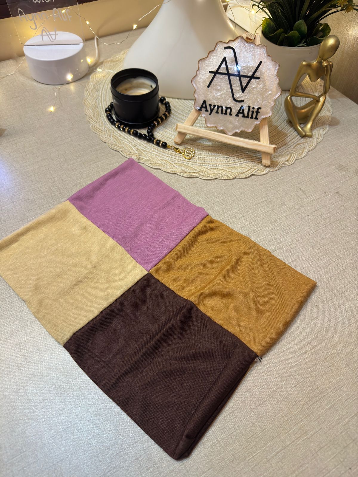 4 in 1 jersey tube band in Tea Pink, Dark Brown, Skin and Topaz by Aynn Alif Pakistan – soft stretchable hijab undercap for secure and polished scarf styling.