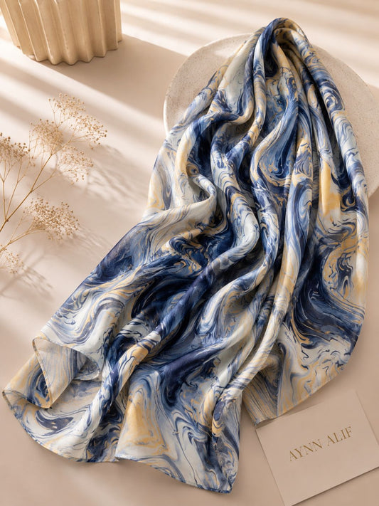 Aynn Alif Azure Marble Modal Lawn Hijab in navy blue, powder blue, ivory and soft gold marble print, extra large, breathable and lightweight.