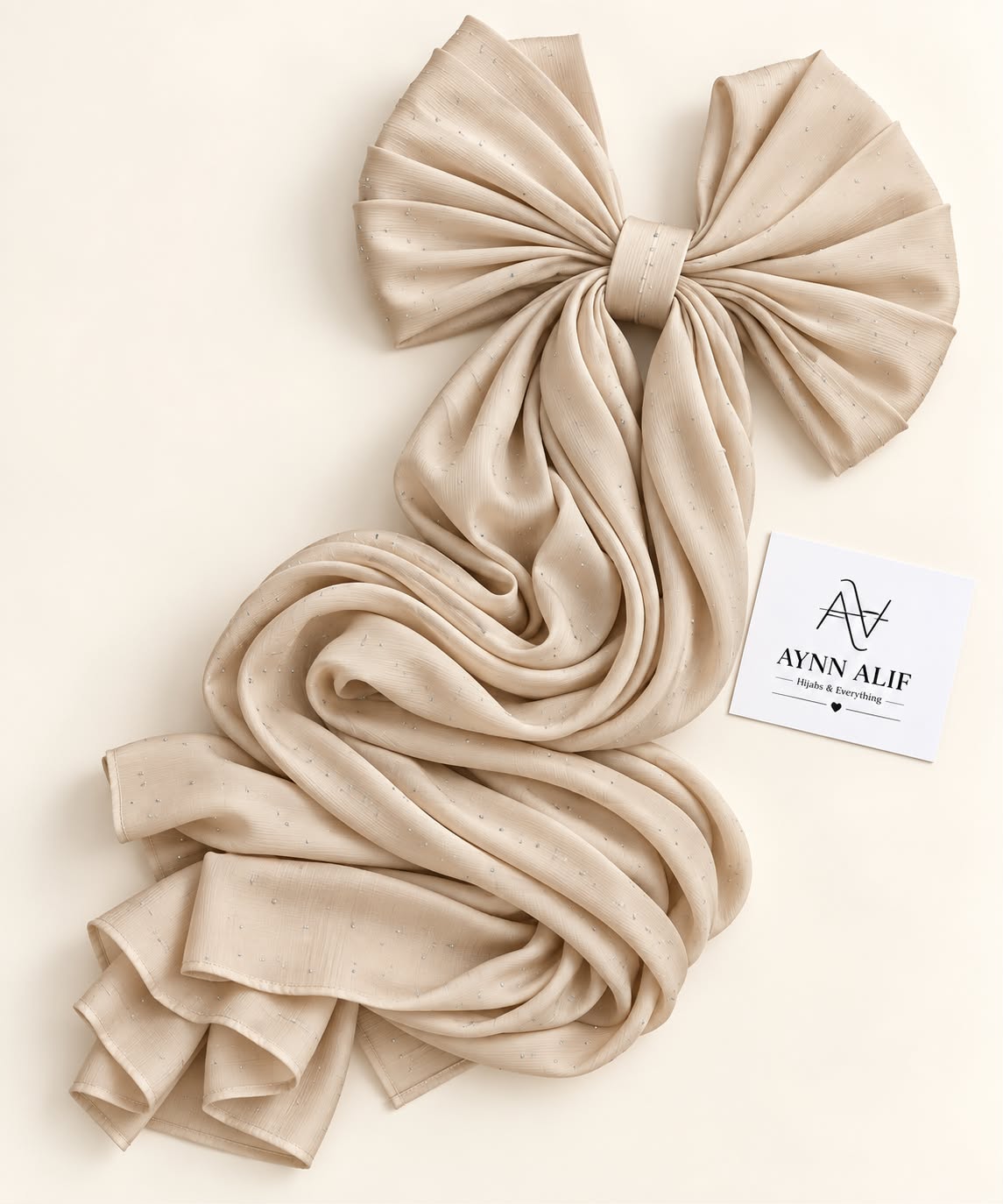 Beige gold stones-studded matte silk hijab with a soft, flowy drape and delicate stone embellishments by Aynn Alif.