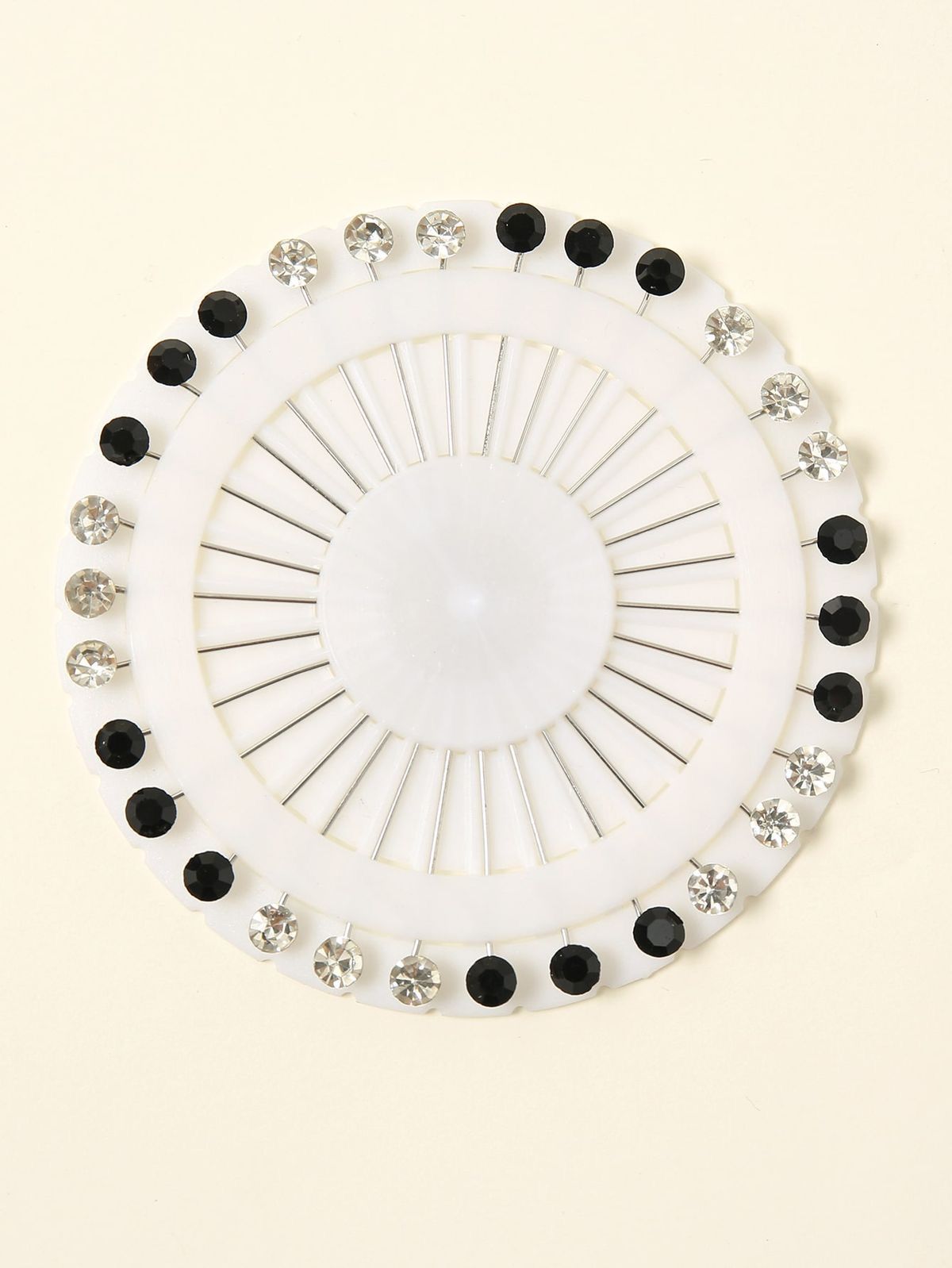 Black and white stones studded hijab pins by Aynn Alif Pakistan with elegant embellished scarf pins for secure hijab styling.