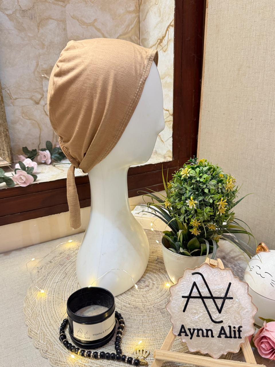 Chestnut cotton tie back underscarf hijab cap by Aynn Alif on mannequin side view