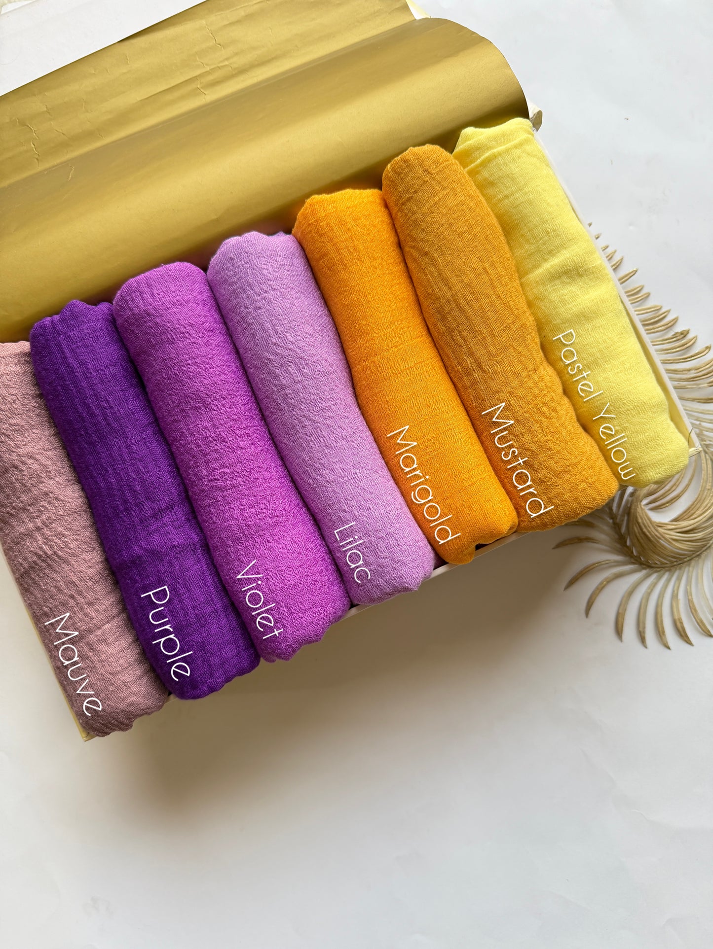 Aynn Alif crimp lawn hijab collection featuring mauve purple violet lilac marigold mustard and pastel yellow breathable anti slip hijabs in Pakistan