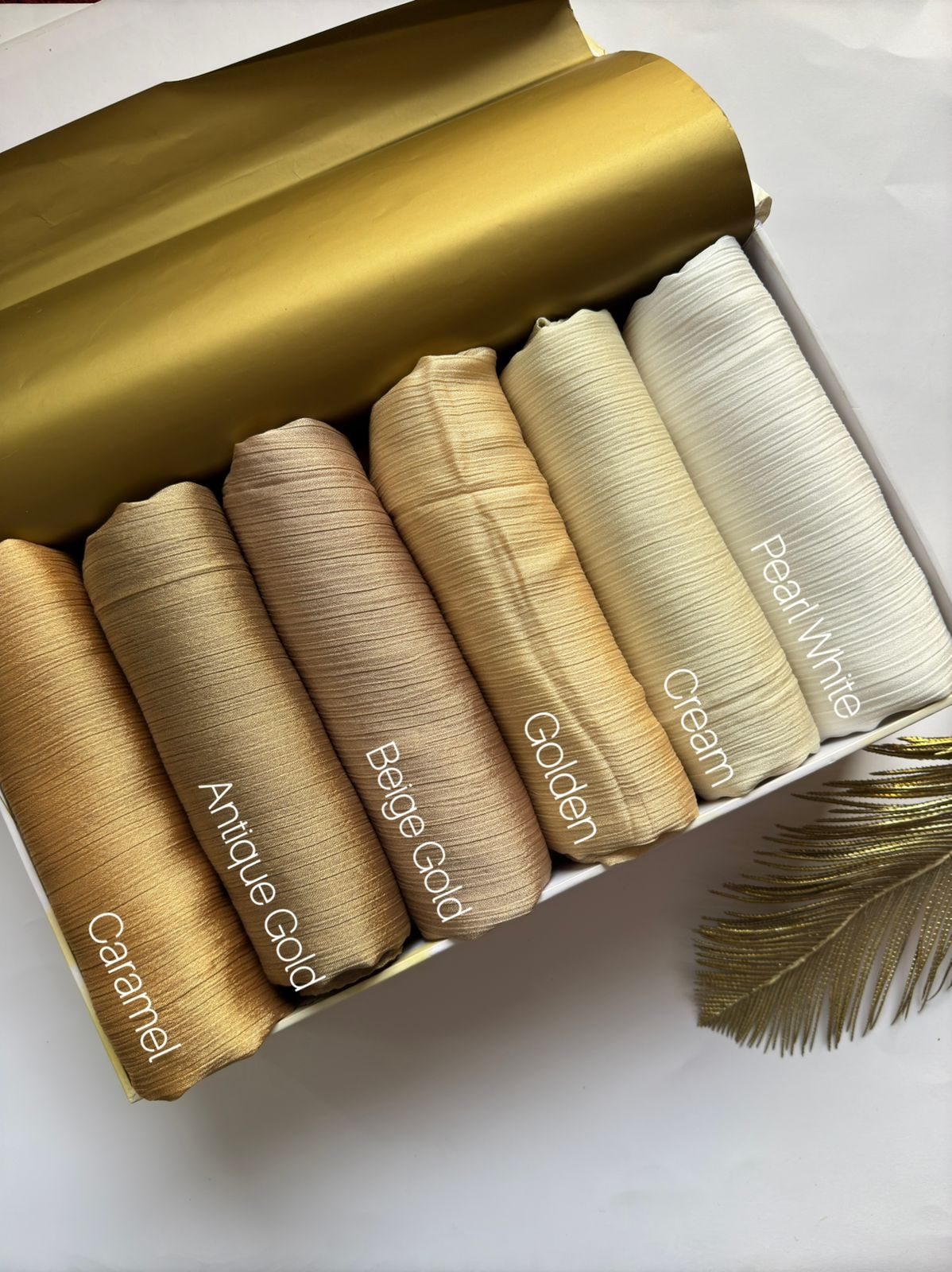 Crinkle Silk Hijab Golden Sands Collection featuring Caramel, Antique Gold, Beige Gold, Golden, Cream and Pearl White shades in premium textured silk fabric.