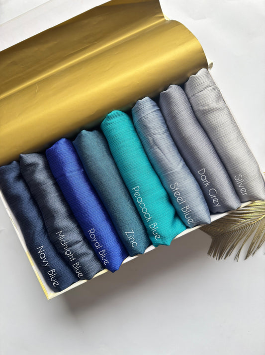 Crinkle Silk Hijab Ocean Mist Collection featuring Navy Blue, Midnight Blue, Royal Blue, Zinc, Peacock Blue, Steel Blue, Dark Grey and Silver shades.