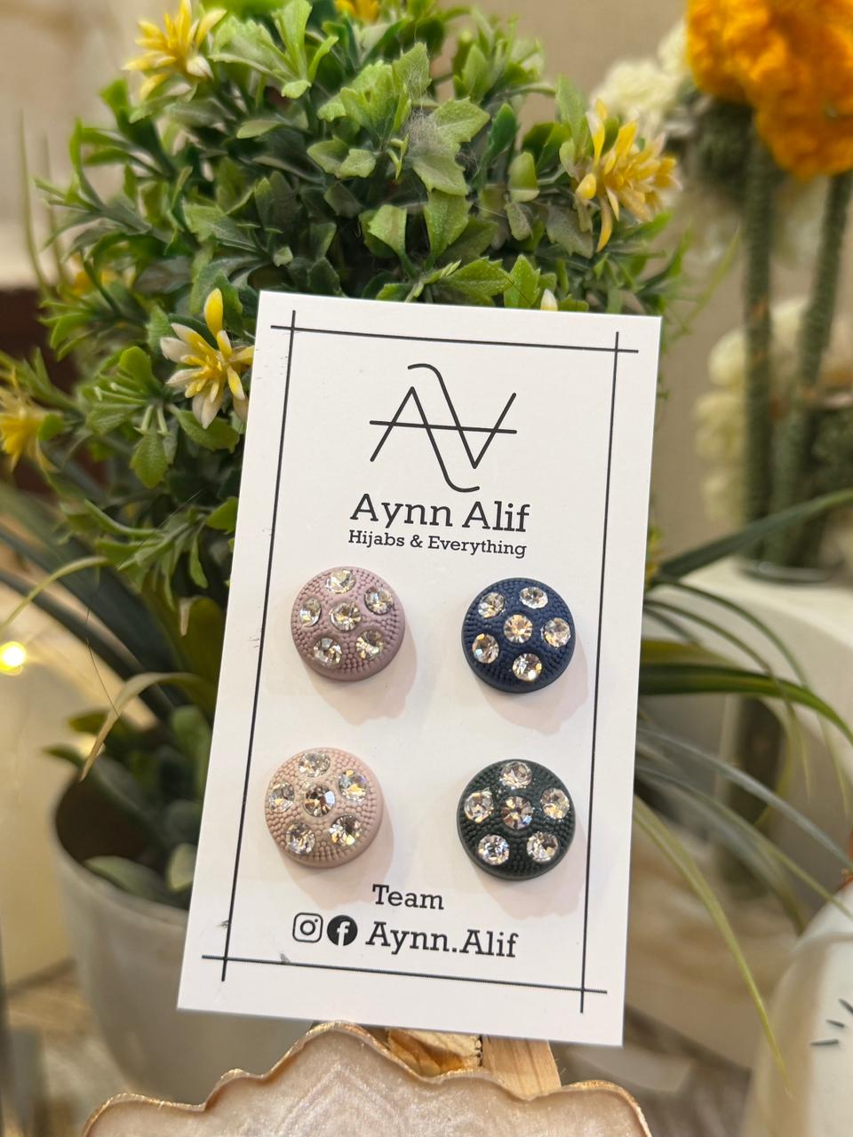 Pastel stone studded hijab magnets in tea pink, navy blue, powder pink and dark green colours by Aynn Alif for elegant hijab styling in Pakistan