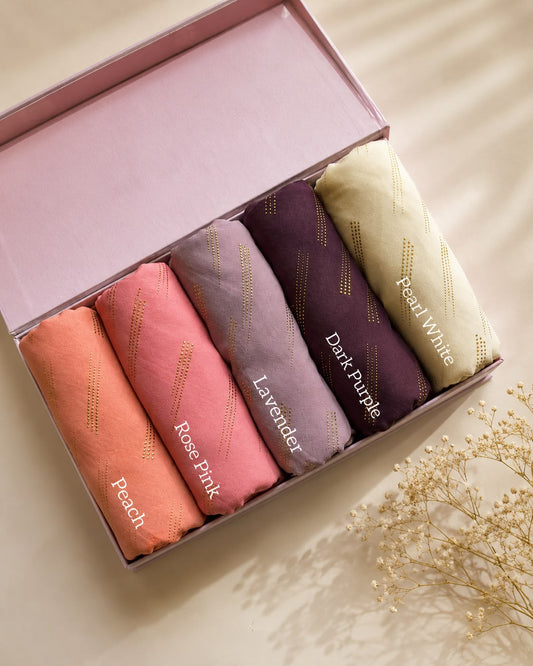 Aynn Alif Golden Dust Chiffon Georgette Hijab featuring golden embossed texture in Peach, Rose Pink, Lavender, Dark Purple and Pearl White premium chiffon fabric.