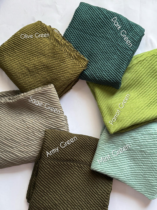 Bubble pleated lawn hijabs by Aynn Alif Pakistan in olive green, sage green, mint green and earthy green shades with lightweight breathable fabric for modest styling.