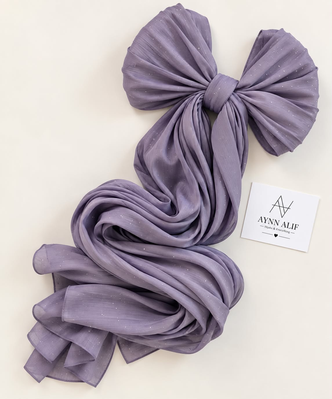 Lavender stones-studded matte silk hijab with a soft, flowy drape and delicate stone embellishments by Aynn Al