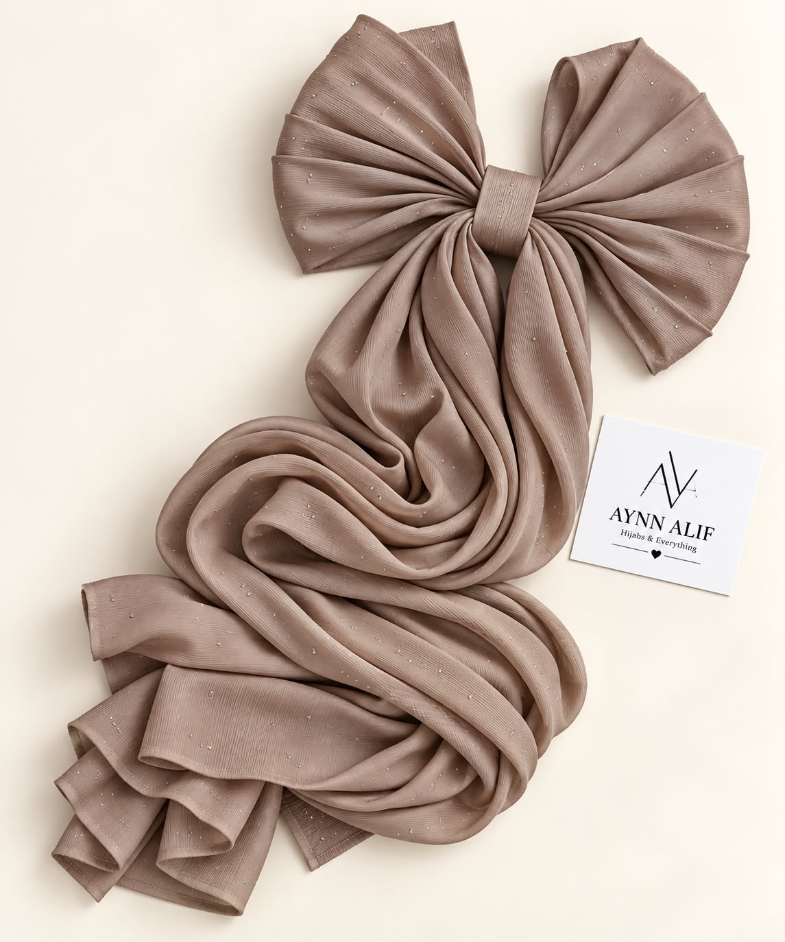 Light brown stones-studded matte silk hijab with a soft, flowy drape and delicate stone embellishments by Aynn Alif.