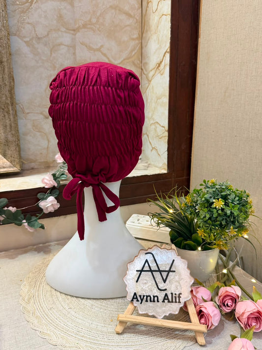 Maroonish Red ruched tie back hijab cap made from soft breathable jersey with full head coverage and adjustable tie-back by Aynn Alif.