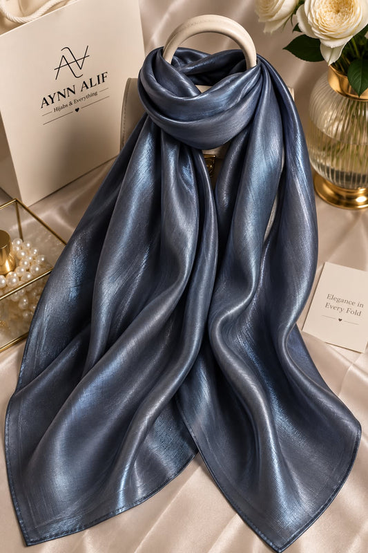 Midnight blue double tone sheen silk scarf with a luminous finish, smooth texture and elegant flowy drape by Aynn Alif.