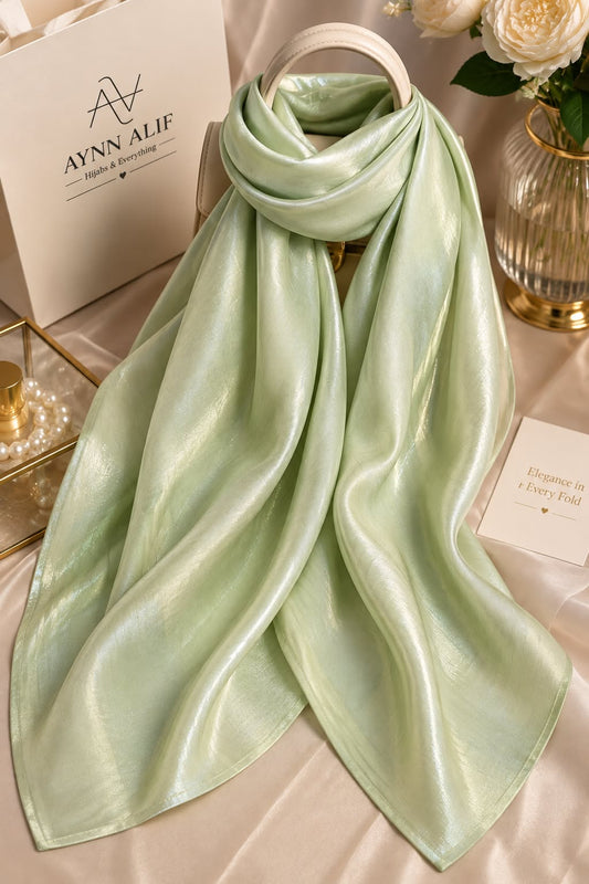 Mint green double tone sheen silk scarf with a luminous finish, smooth texture and elegant flowy drape by Aynn Alif.