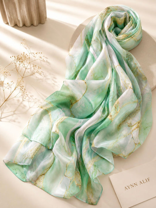 Aynn Alif extra large printed modal lawn hijab featuring a mint green, ivory white and gold marble design with soft breathable fabric and elegant drape.