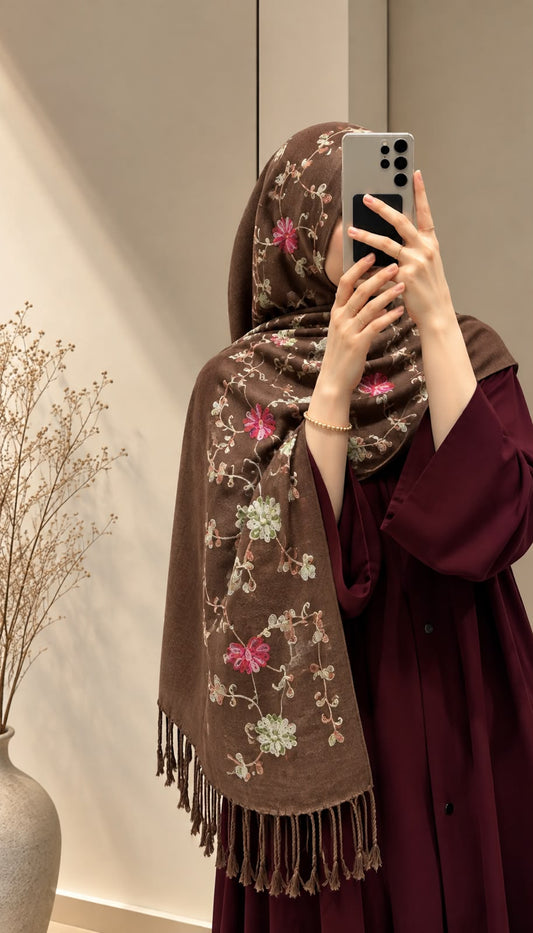 Mocha brown cashmere embroidered hijab featuring colourful floral embroidery, delicate sequin embellishments, and matching fringed edges by Aynn Alif.