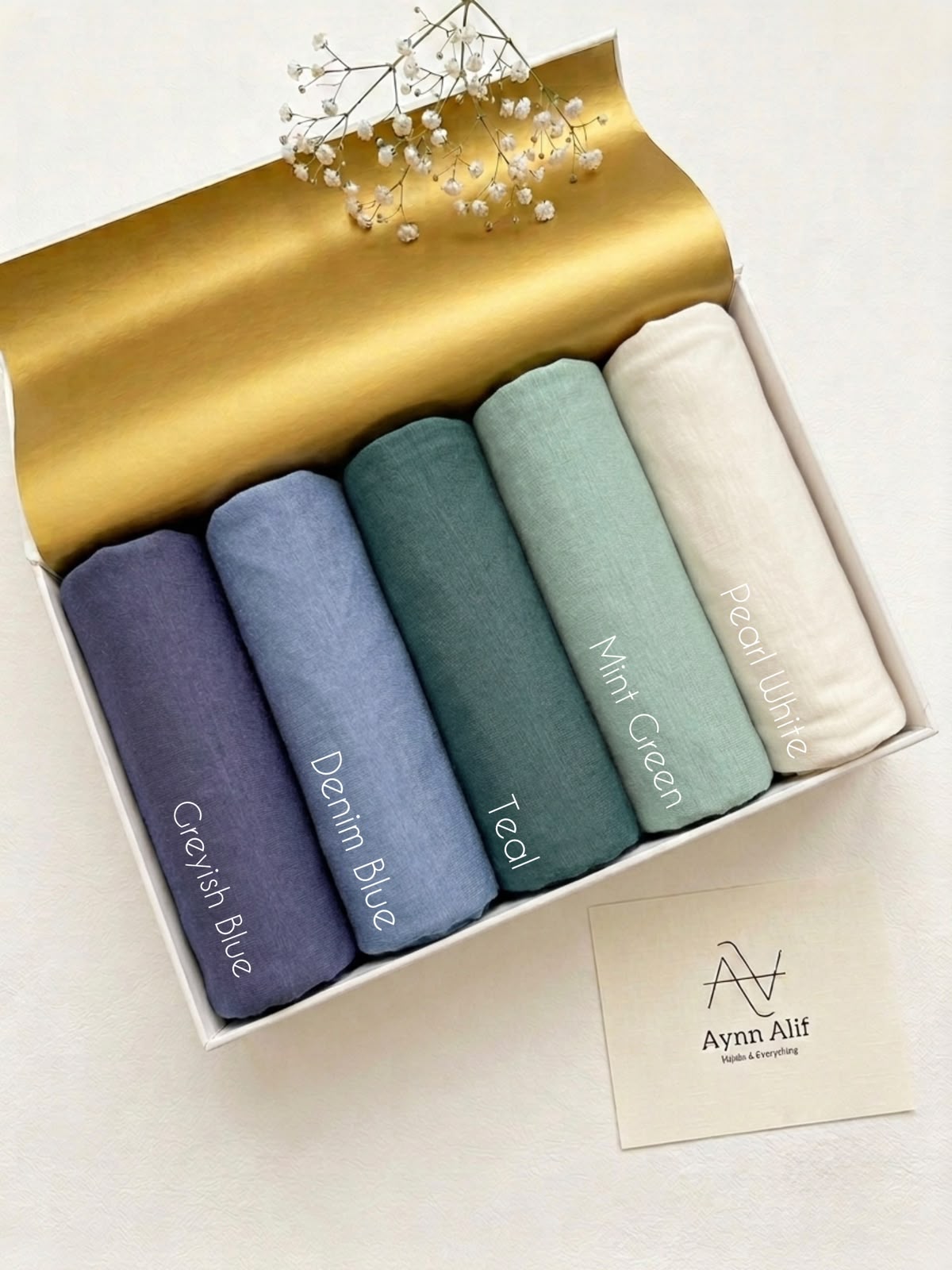 Shop Turkish Plain Jersey Hijabs by Aynn Alif in Pakistan. Extra-large 76×34 inch hijabs in blue, teal, mint and pearl white for generous coverage.