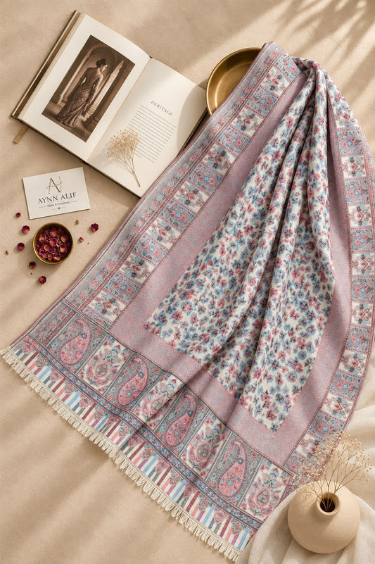 Aynn Alif Kashmiri Kani mini shawl in powder pink, sky blue and ivory, featuring delicate floral motifs, intricate paisley borders, pastel patterns and decorative fringe detailing.