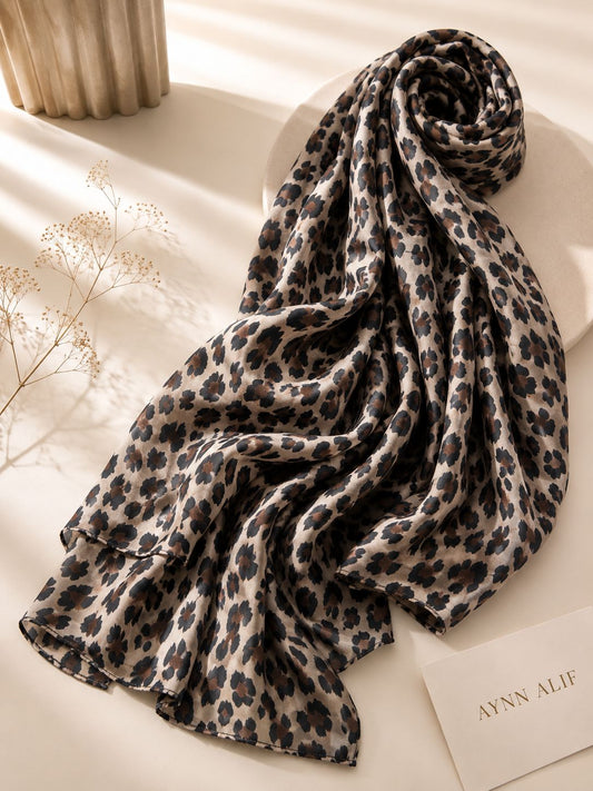 Extra large leopard print modal lawn hijab in beige, mocha brown and black tones with soft breathable fabric and double-sewn edges