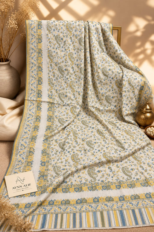 Yellow green Kashmiri Kani shawl with an ivory base, intricate paisley motifs, floral patterns and mustard yellow and sage green decorative borders by Aynn Alif Pakistan
