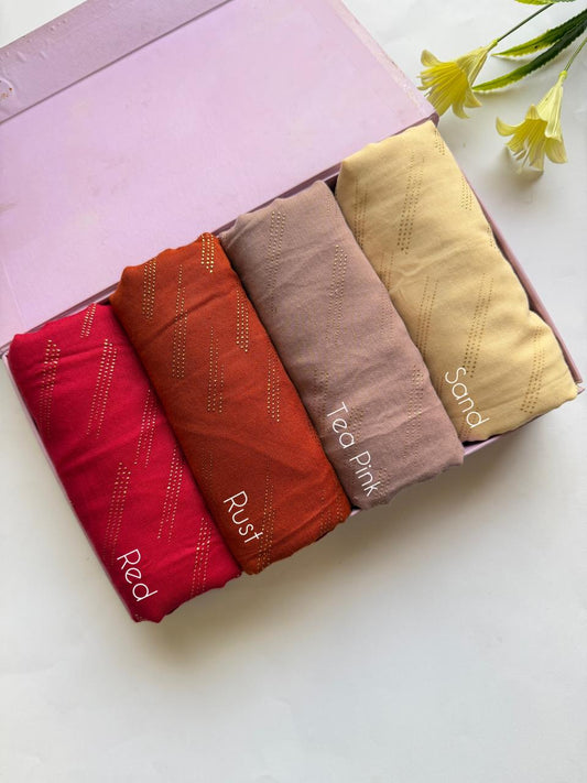 Warm tone lawn hijabs set in red, rust, tea pink and sand with golden embossed dot design in elegant box