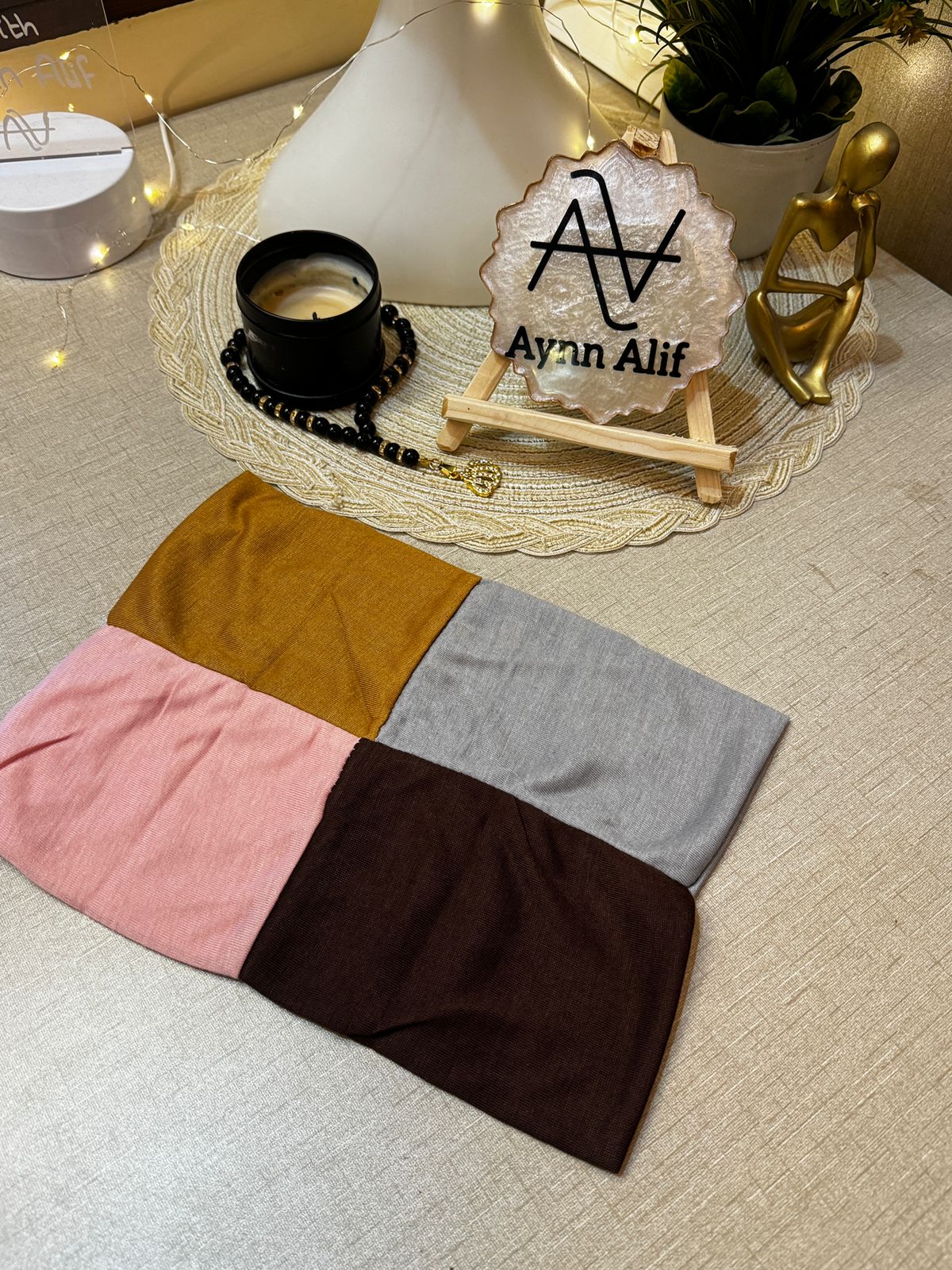 4 in 1 jersey tube band in Baby Pink, Topaz, Dark Brown and Light Grey by Aynn Alif Pakistan – soft stretchable hijab undercap for secure and polished scarf styling.