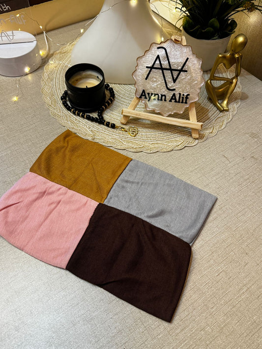 4 in 1 jersey tube band in Baby Pink, Topaz, Dark Brown and Light Grey by Aynn Alif Pakistan – soft stretchable hijab undercap for secure and polished scarf styling.