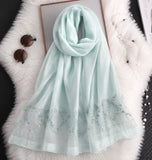 Aqua blue cotton silk hijab with embroidered organza border and pearl detailing.