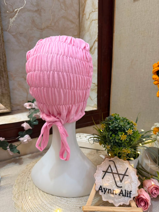 Baby Pink ruched tie back hijab cap made from soft breathable jersey with full head coverage and adjustable tie-back by Aynn Alif.