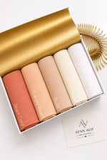 Aynn Alif plain jersey hijabs in Desert Coral, Creamy Peach, Nude, Cream and White displayed together.