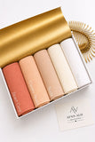 Aynn Alif plain jersey hijabs in Desert Coral, Creamy Peach, Nude, Cream and White displayed together.