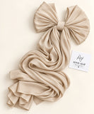 Beige gold stones-studded matte silk hijab with a soft, flowy drape and delicate stone embellishments by Aynn Alif.