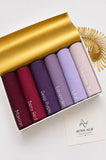 Aynn Alif plain jersey hijabs in Maroon, Berry Red, Deep Purple, Lavender, Lilac and Lavender Blush arranged in a collection.