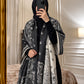 Charcoal black and ivory paisley reversible woolen wrap styled over a black modest outfit