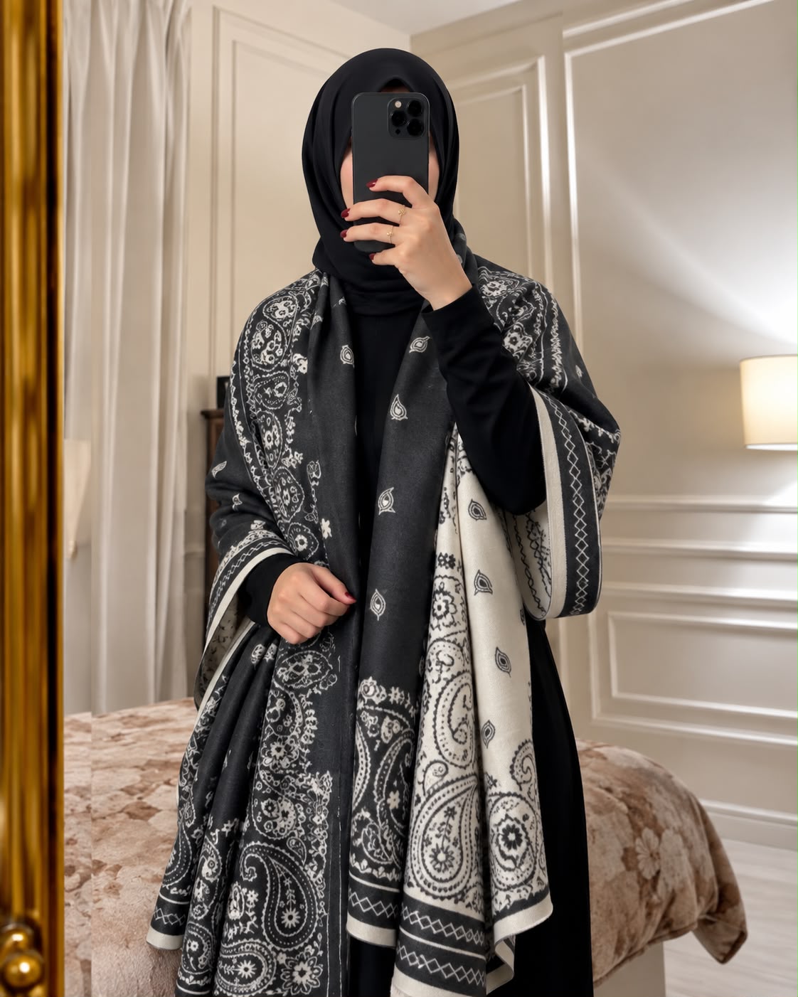 Charcoal black and ivory paisley reversible woolen wrap styled over a black modest outfit
