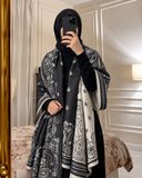 Charcoal black and ivory paisley reversible woolen wrap styled over a black modest outfit