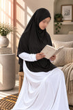 Girl wearing a black colour Aynn Alif teens jersey makhna scarf with adjustable back elastic, designed for a secure and comfortable fit for ages 11–16.