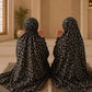 Black Mother & Daughter Matching Namaz Chaadar Set in black floral lawn fabric with adjustable fit and wudu-friendly elastic sleeves.