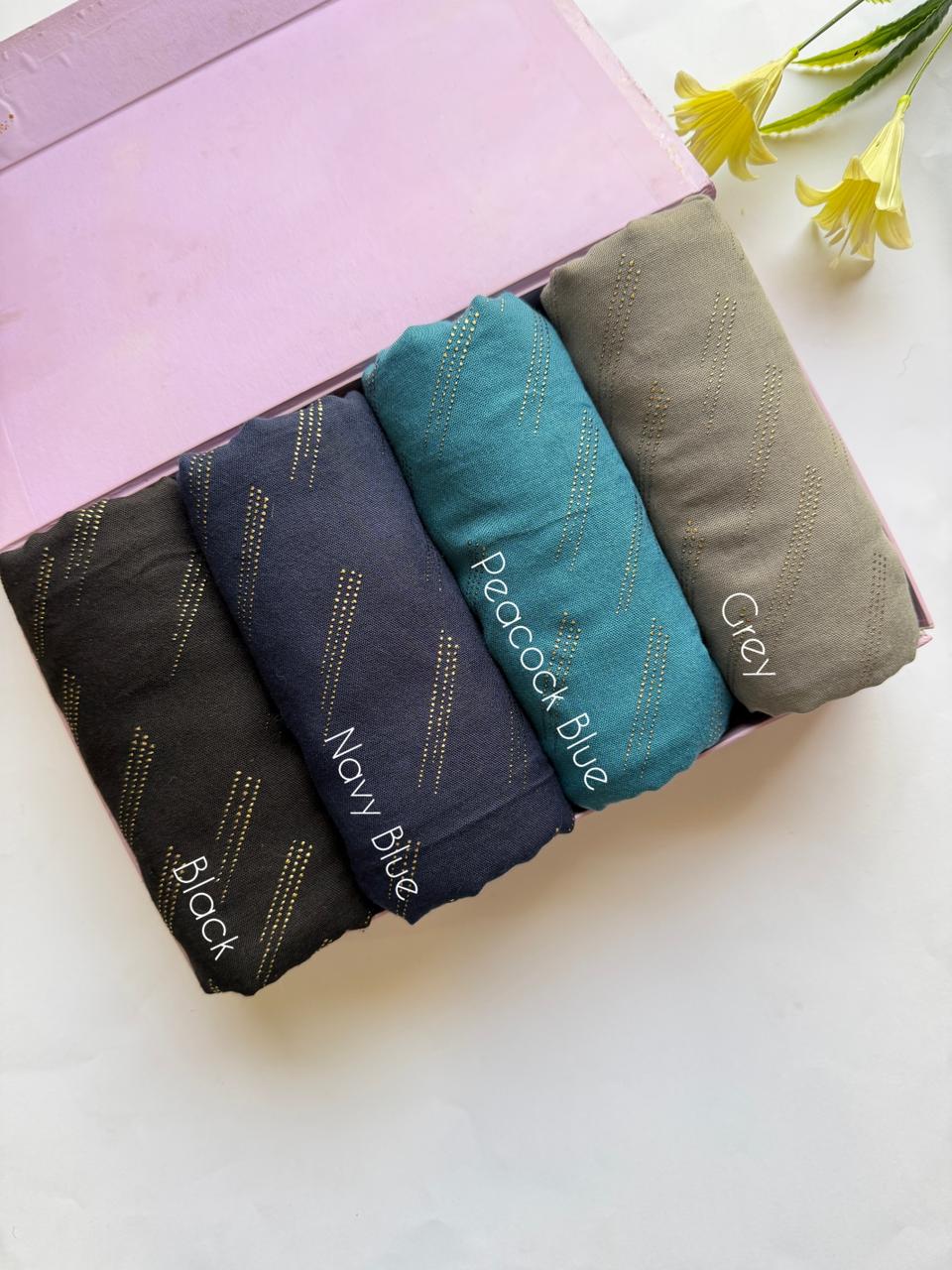 Deep tone lawn hijabs set in black, navy blue, peacock blue and grey with golden embossed dot pattern in box packaging