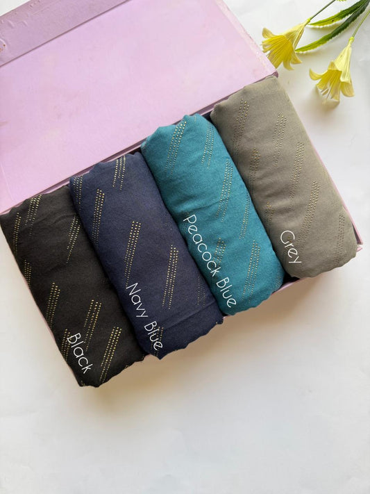 Deep tone lawn hijabs set in black, navy blue, peacock blue and grey with golden embossed dot pattern in box packaging