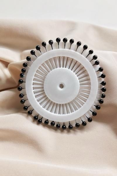 Black pinwheel hijab pins by Aynn Alif Pakistan featuring 30 premium black scarf pins for everyday hijab wear.
