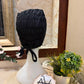 
Black ruched tie back hijab cap made from soft breathable jersey with full head coverage and adjustable tie-back by Aynn Alif.