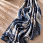 Blue marble printed modal lawn hijab in navy blue, ivory and gold abstract pattern, extra-large breathable scarf with soft flowing drape.