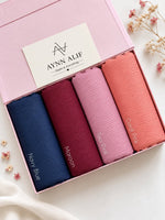 Blush & Berry Ribbed Jersey Hijab Box featuring Navy Blue, Maroon, Soft tea Pink and coral pink premium anti-slip narrow ribbed jersey hijabs.