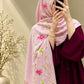 Blush pink cashmere embroidered hijab featuring colourful floral motifs, delicate sequin embellishments, and matching pink fringed edges by Aynn Alif.