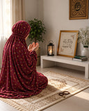 Aynn Alif burgundy namaz chaadar featuring a delicate multicolour mini floral print, styled on a prayer mat in a serene prayer setting.