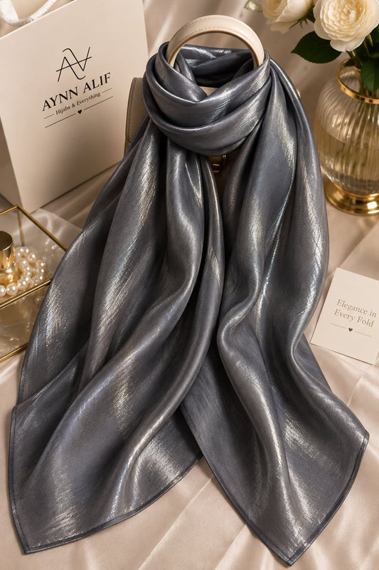 Charcoal grey double tone sheen silk scarf with a luxurious luminous finish, smooth texture and elegant flowy drape by Aynn Alif.