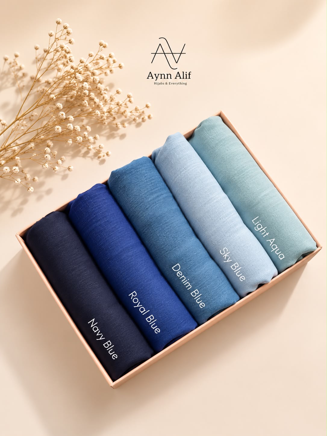 Coastal Blues Turkish lawn hijabs in standard size featuring navy blue, royal blue, denim blue, sky blue and light aqua in breathable lightweight fabric.