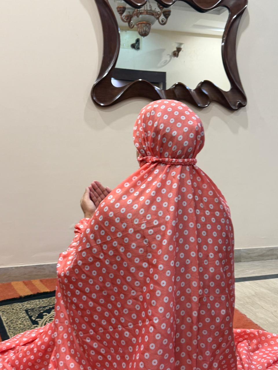 Coral pink namaz chaadar with white rings by Aynn Alif Pakistan featuring elastic sleeves, elastic headband, wudu-friendly design, breathable fabric, and full coverage prayer wear for women.