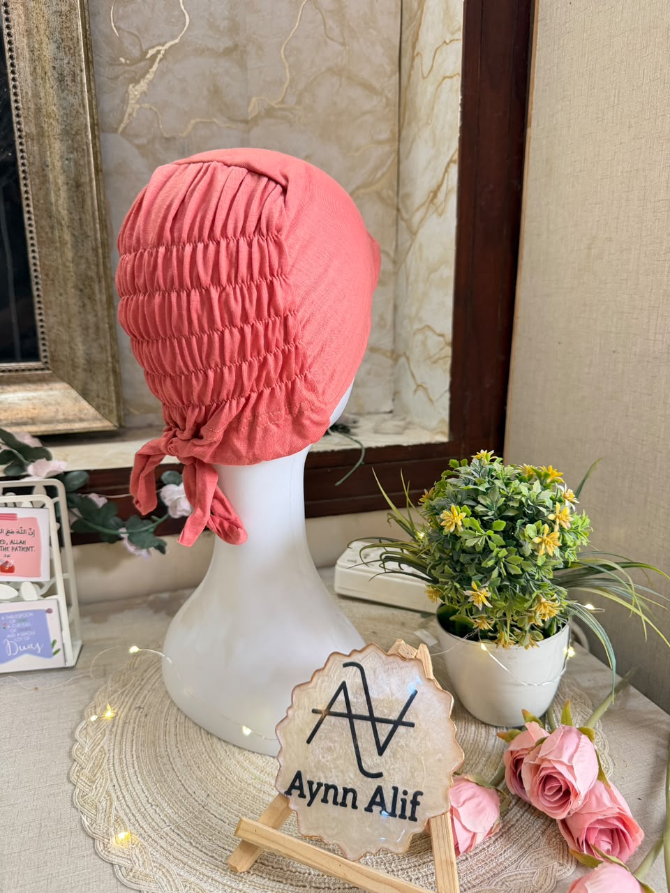 Coral Pink ruched tie back hijab cap made from soft breathable jersey with full head coverage and adjustable tie-back by Aynn Alif.