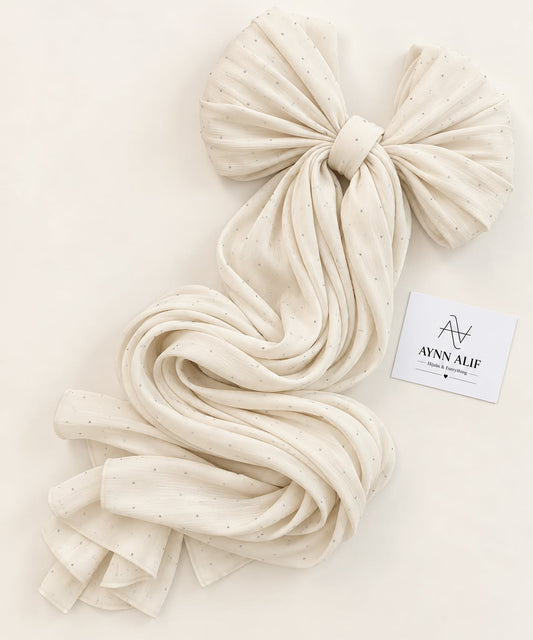 Cream stones-studded matte silk hijab with a soft flowy drape and delicate stone embellishments by Aynn Alif.