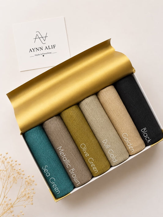 Crimped Moonlight Jersey Hijab Collection by Aynn Alif Pakistan featuring Sea Green, Metallic Brown, Olive Green, Dull Gold, Golden, and Black shades in soft, breathable, lightweight textured jersey fabric.